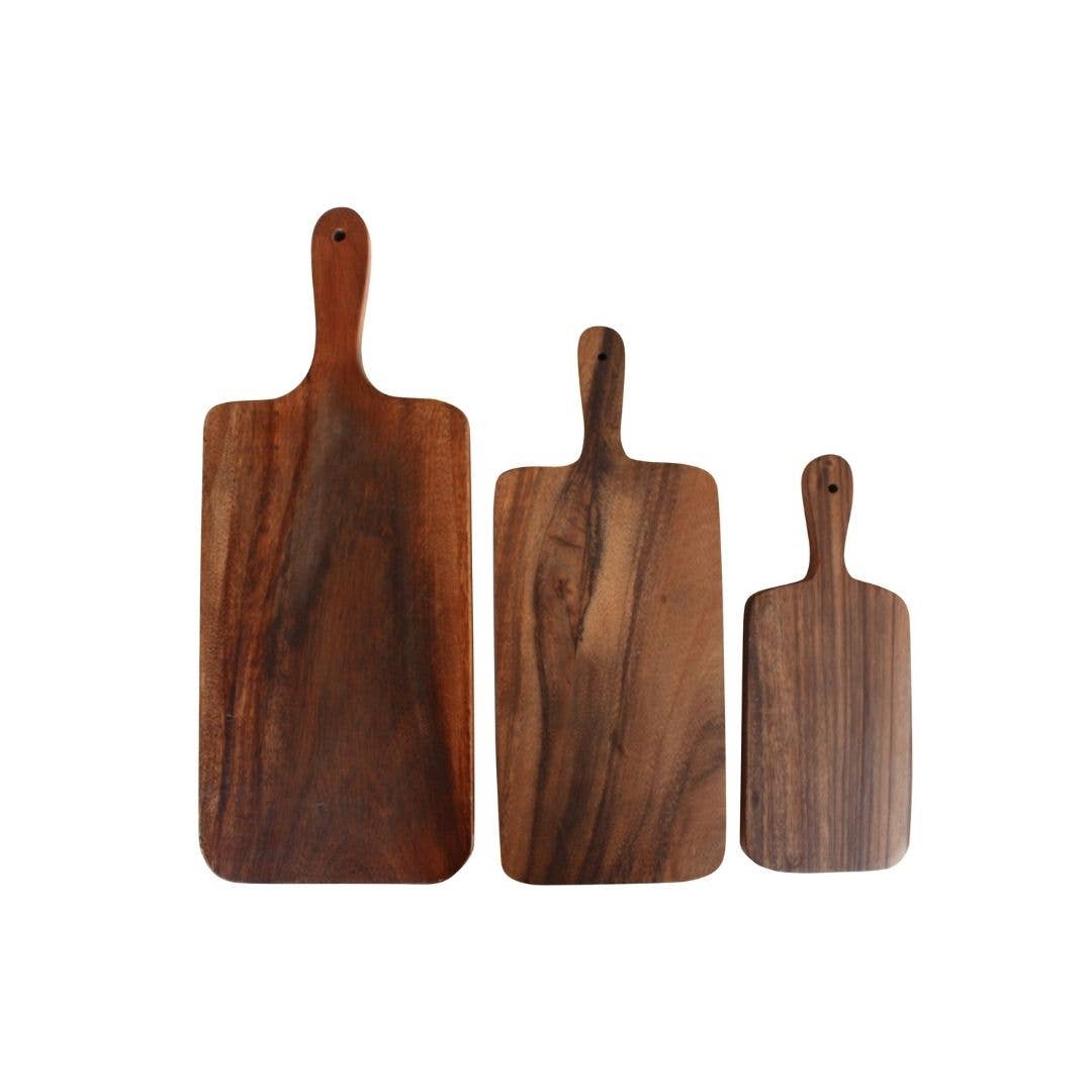 Three wooden serving boards of different sizes with rounded handles, displayed against a plain white background.